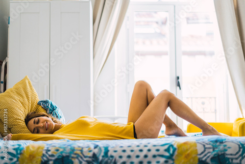 Seductive woman lying on bed