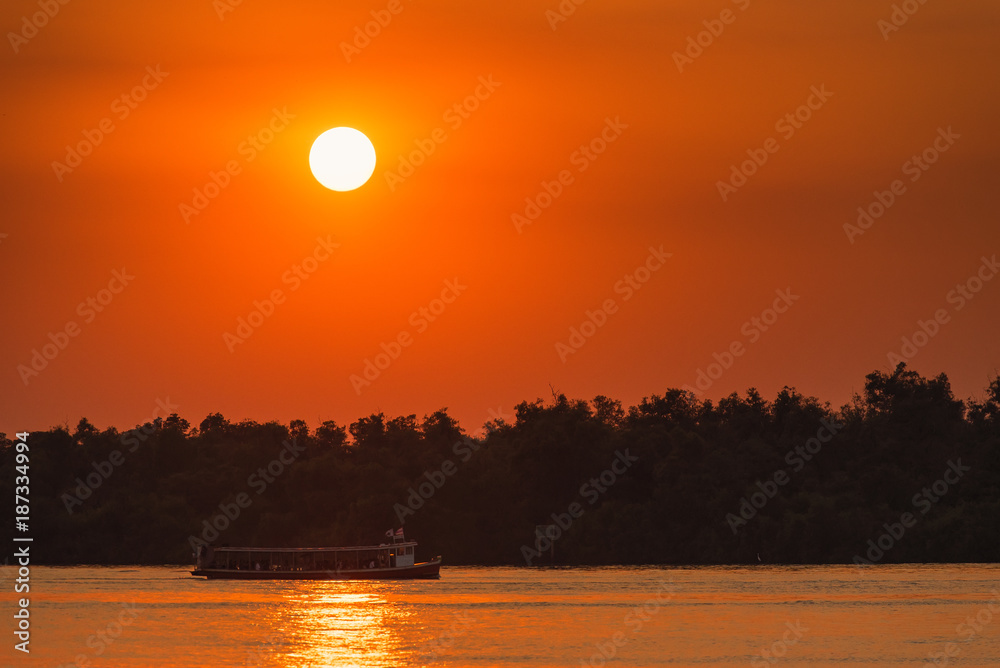 Ferry boat in the Chao Phraya River at estuary in sunsrt time at Samut Prakan, Thailand.