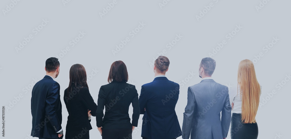 Obraz premium Successful business team looking upwards standing back side