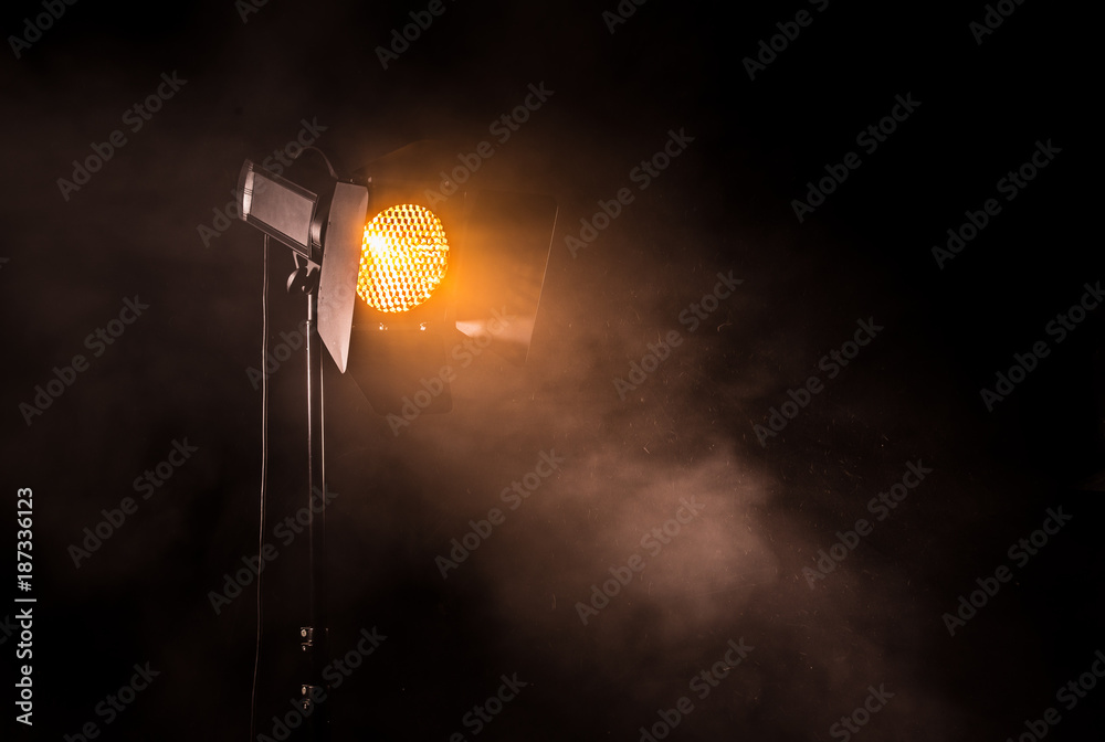 Fototapeta premium Theater spot light on black background.