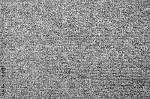 close up of monochrome grey carpet texture background from above