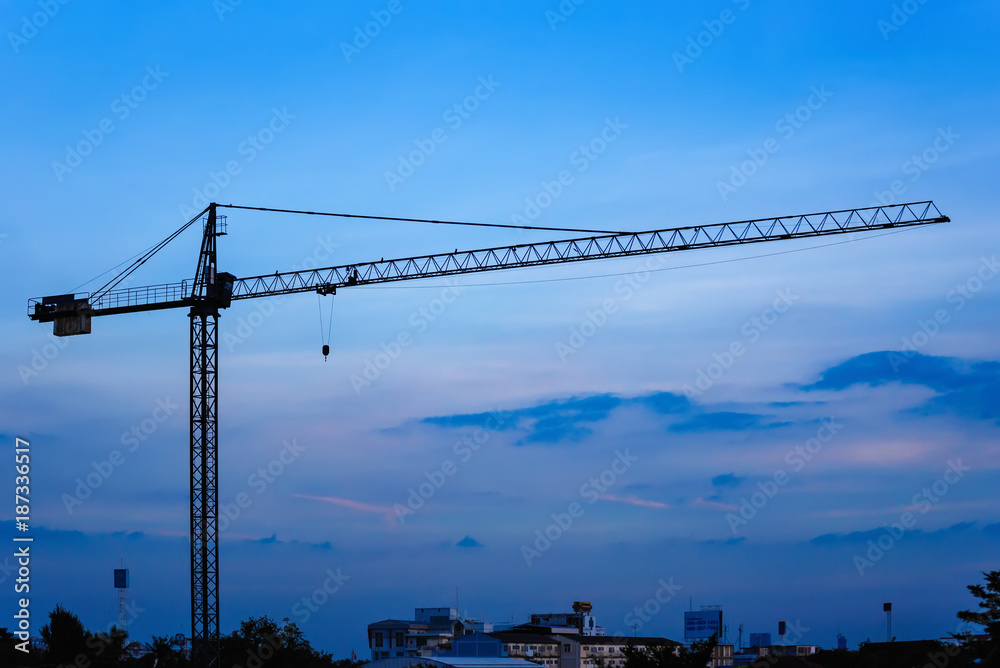 Building crane and construction site under sunset.Thailand. Building crane and construction site under sunset.Thailand.