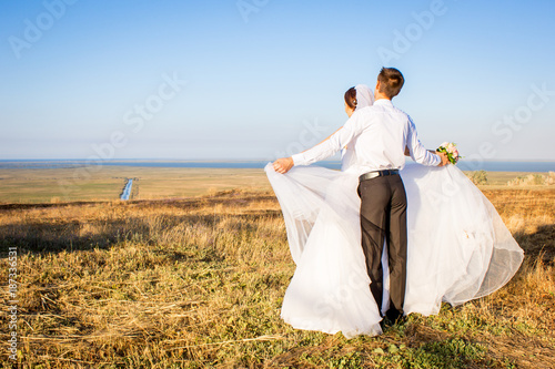 couple in love at a wedding on a sky background