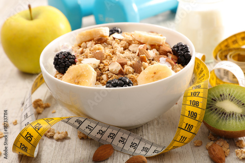 bowl of cereal, fruit and dumbbell