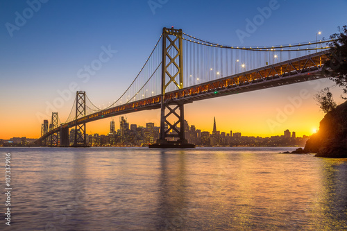 San Francisco skyline with Oakland Bay Bridge at sunset, California, USA