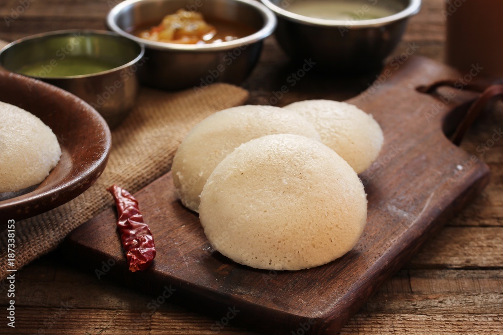 Idli with sambar chutney - South Indian breakfast made of lentil and rice Idli with sambar chutney - South Indian breakfast made of lentil and rice