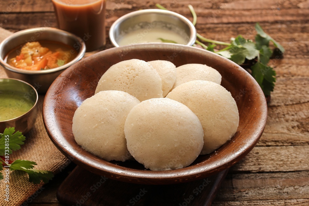 Idli with sambar chutney - South Indian breakfast made of lentil and rice Idli with sambar chutney - South Indian breakfast made of lentil and rice