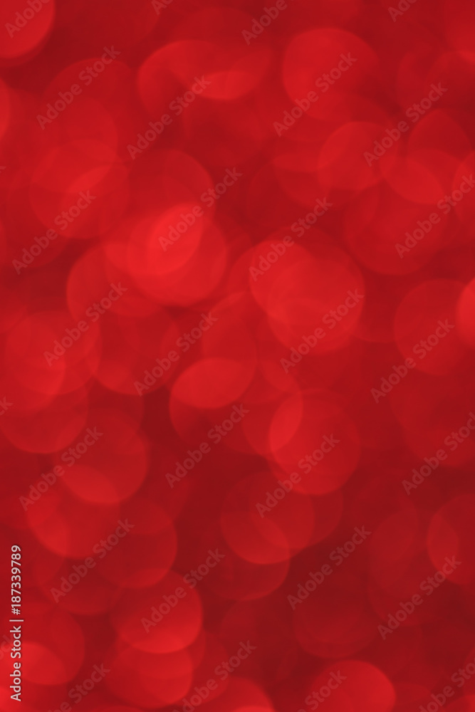 Red glitter bokeh lights background / Defocused illumination for holidays backgrounds