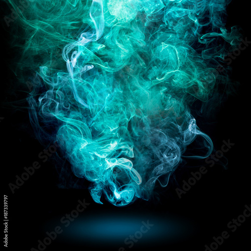 bluish-green swirl of smoke on black background