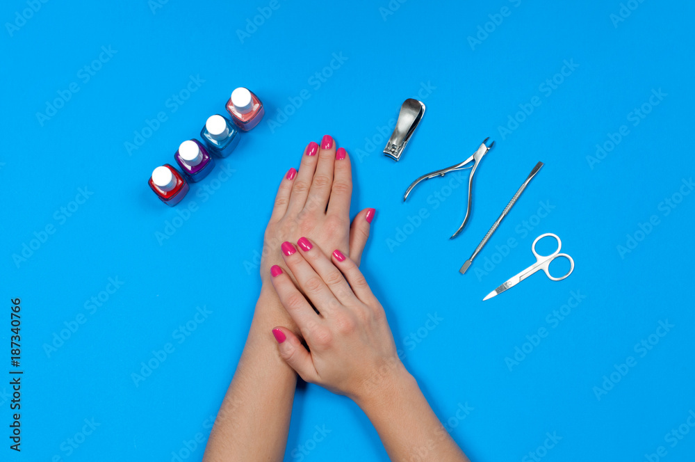 Naklejka premium Nail salon. Beautiful female hands with pink manicure.