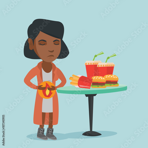 African sad woman standing near the table with fast food and having a stomach ache from heartburn. Young woman suffering from a heartburn after fast food. Vector cartoon illustration. Square layout.