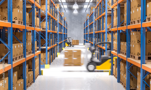 interior of a warehouse full of goods ready to be shipped, no one around, forklift truck in action. shipping and logistics concept.