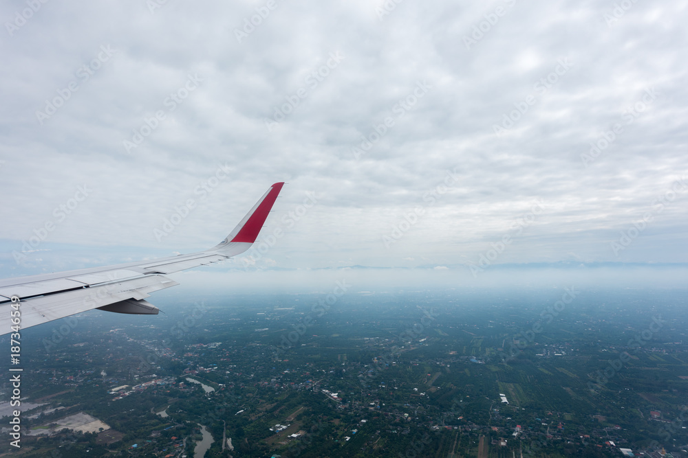 Cloudy sky and top view of Chiang mai from airplane