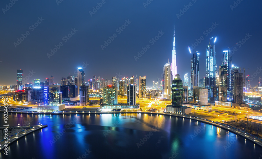Dubai skyline and water canal with promenade after the sunset, Dubai,United Arab Emirates