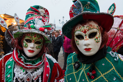 People in mask wearing carnival dress pose during the Venice Carnival