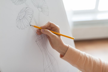 artist with pencil drawing picture at art studio