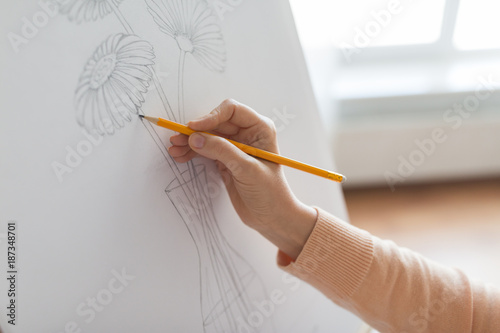 artist with pencil drawing picture at art studio