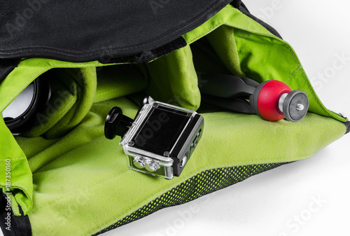 action camera in waterproof case and small tripod