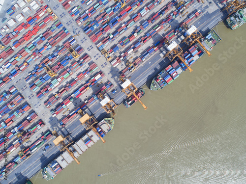 container,container ship in import export and business logistic,By crane,Trade Port , Shipping,cargo to harbor.Aerial view,Water transport,International,Shell Marine,transportation,logistic,trade,port © MAGNIFIER