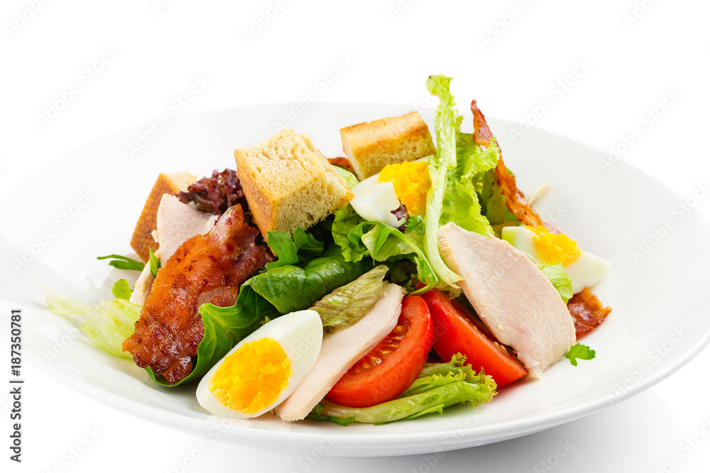 Fresh green salad with chicken, bacon, eggs, tomatoes and croutons Fresh green salad with chicken, bacon, eggs, tomatoes and croutons
