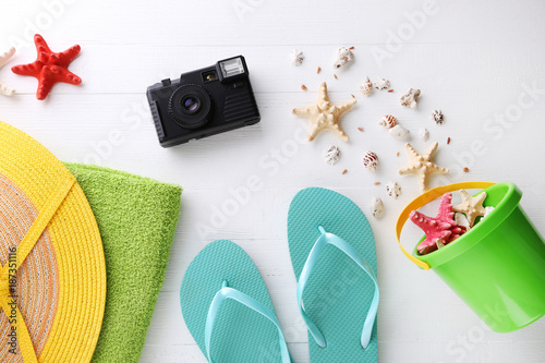 Beach accessories on white wooden table