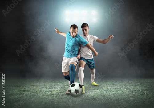 Soccer player on a football field in dynamic action at summer da © Andrii IURLOV