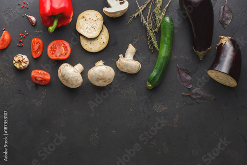 Vegetables on dark background top view copy space
