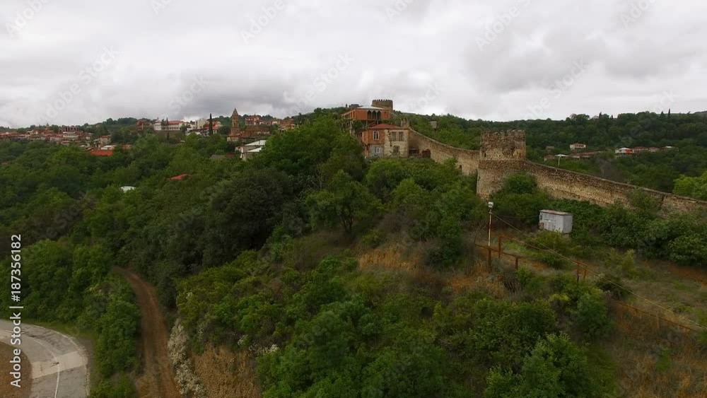 Drone flying above old Sighnaghi town in Georgia, view of stone wall and houses Drone flying above old Sighnaghi town in Georgia, view of stone wall and houses