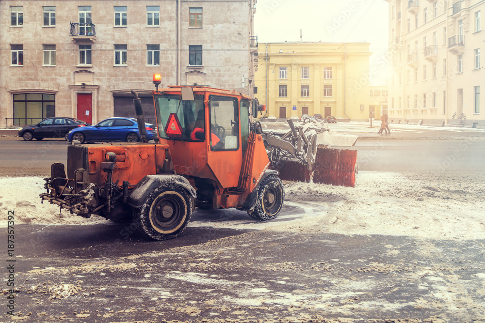 Snow removal vehicles in the street in winter