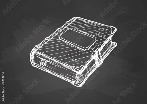 old book on blackboard