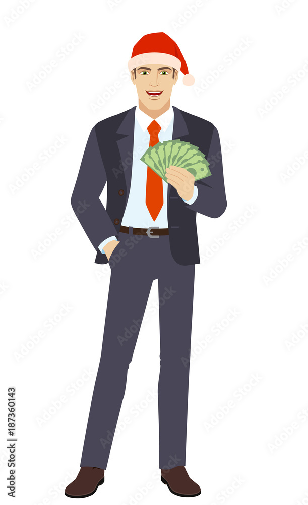 Businessman in Santa hat with hand in pocket and with cash money Businessman in Santa hat with hand in pocket and with cash money