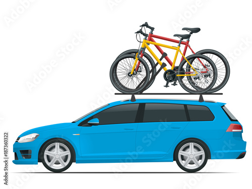 Side view station wagon car with two bicycles mounted on the roof rack. Flat style vector illustration isolated on white background.