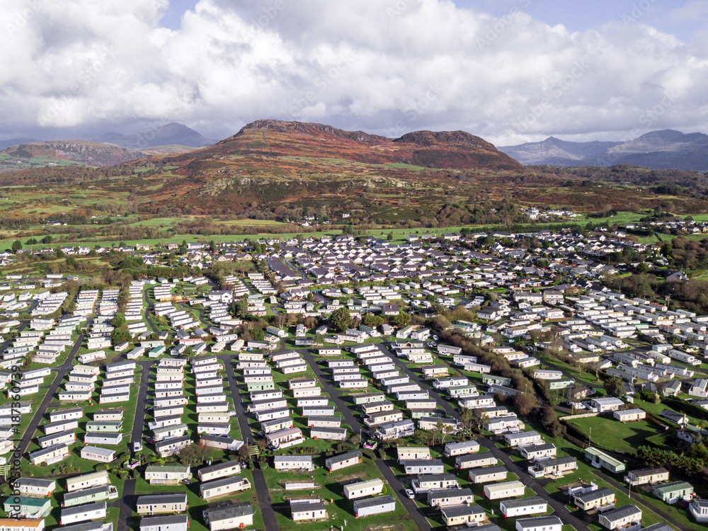 Fototapeta premium Caravan and camping, static home aerial view. Porthmadog holiday park taken from the air by a drone