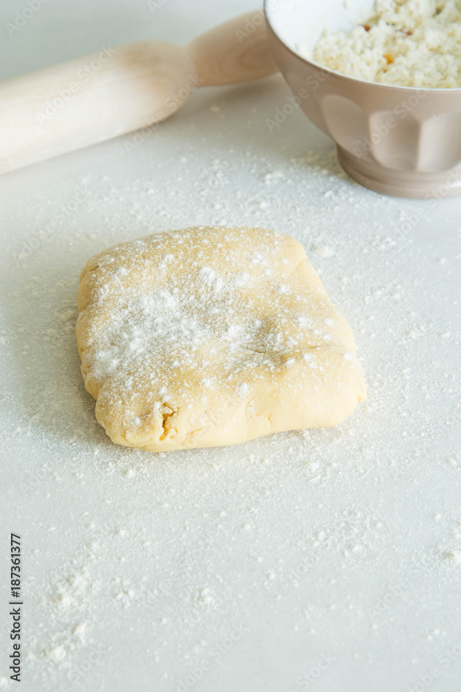 Cookie Dough Rolled out with Rolling Pin on a white Background. Cookie Dough Rolled out with Rolling Pin on a white Background.