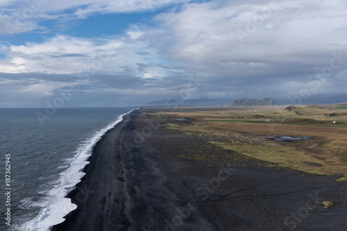 Black sands and some distant land