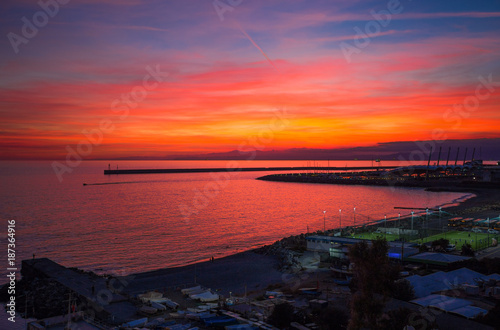 Beautiful and colorful sunset in Genoa (Genova), Ligurian coast, Mediterranean sea, Italy