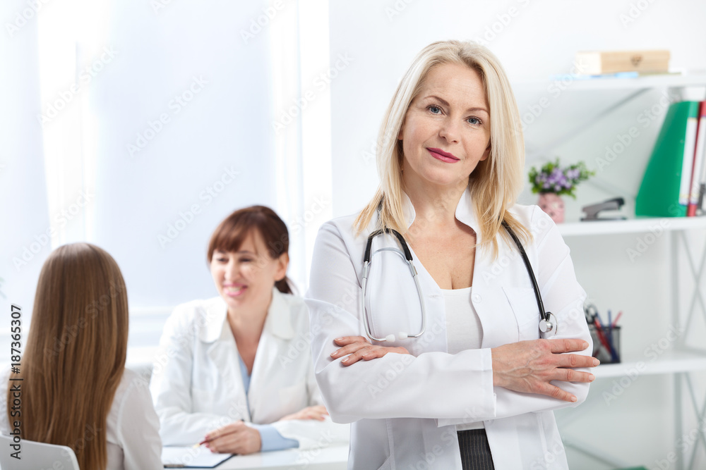 Doctor with stethoscope. Healthcare and medical concept - doctor with patient in hospital Doctor with stethoscope. Healthcare and medical concept - doctor with patient in hospital