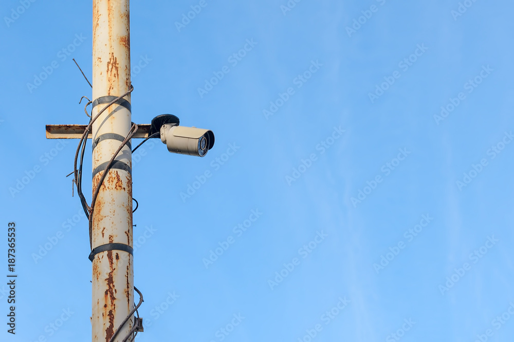Fototapeta premium security surveillance camera on the pole