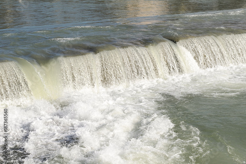 waterfall on the river in summer day  close-up