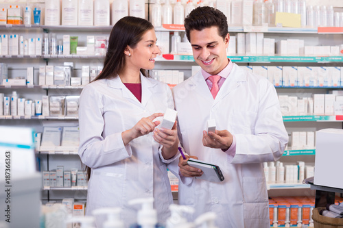 pharmacists  posing in drugstore