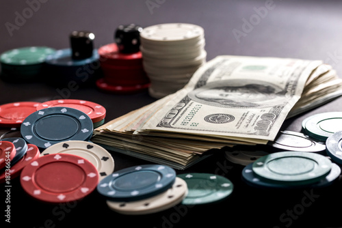 poker cards, chips, dice and dollars