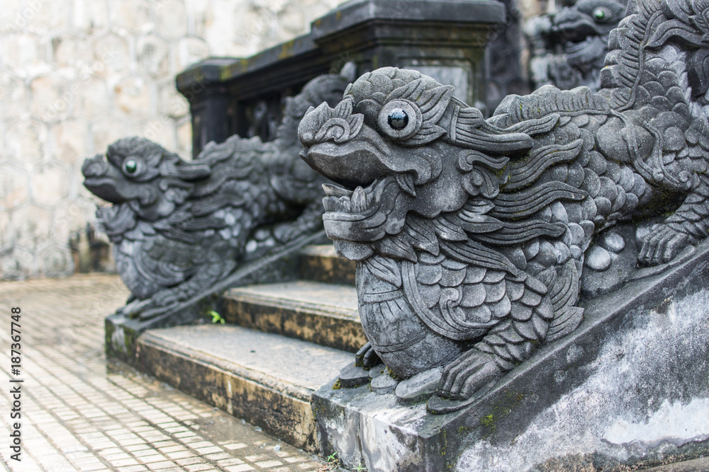 Sacred ancient dragon statues in Hue. The tomb of Emperor Khai Dinh.