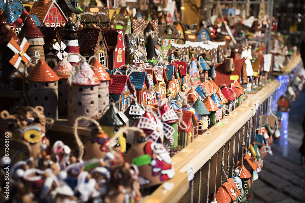 Fototapeta premium Tallinn, Eesti - December 2017: Showcase of Christmas stall on fair in Tallinn with traditional christmas gifts selective focus.