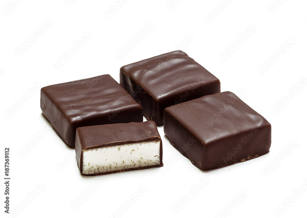 Four chocolate candies isolated on white background, bird's milk Four chocolate candies isolated on white background, bird's milk