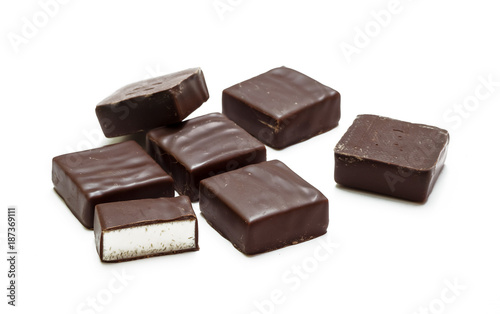 A bunch of chocolate candies isolated on white background, bird's milk