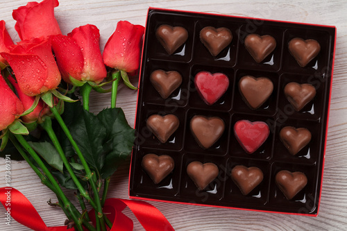 Valentines day with red roses and chocolate