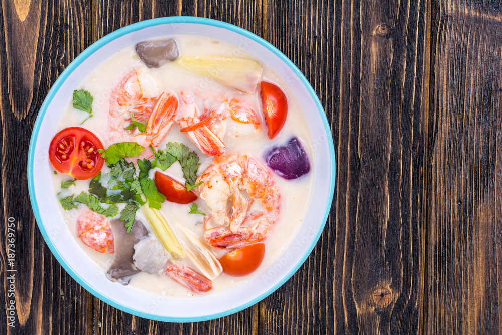 Delicious hot Thai soup Tom Yam with coconut milk and shrimps Delicious hot Thai soup Tom Yam with coconut milk and shrimps