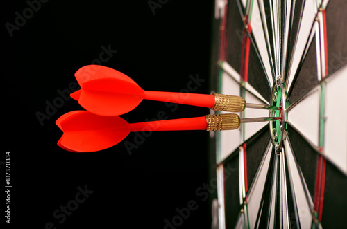 Dart in center of the target dartboard