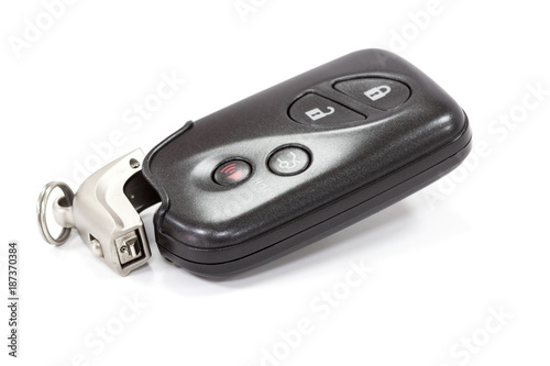 automobile electronic key transmitter for remote central locking and opening the trunk. hide sliced forearm.