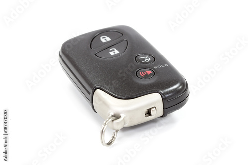 automobile electronic key transmitter for remote central locking and opening the trunk. hide sliced forearm.